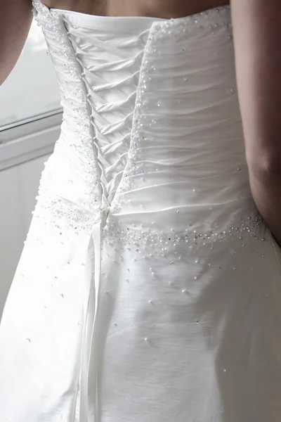 Lace up a wedding dress — Stock Photo, Image