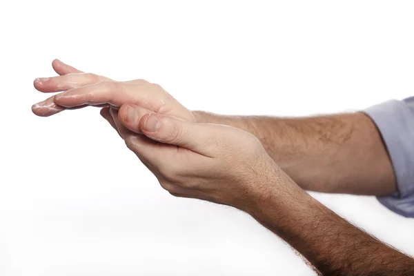 Mann benutzt Handcreme — Stockfoto