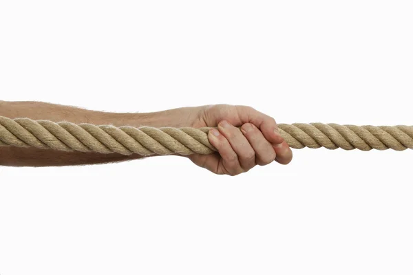 Man pulling rope — Stock Photo, Image