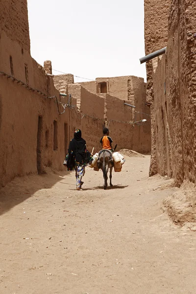 Desert inhabitants with donkeys — Stock Photo, Image