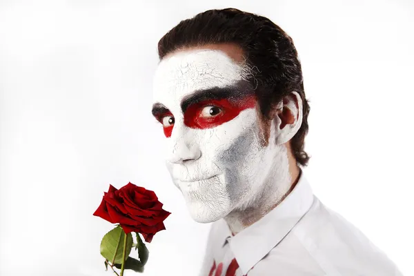 Man with white mascara and red rose — Stock Photo, Image