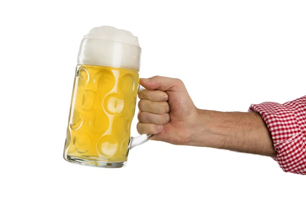 Man in traditional Bavarian shirt holds mug of beer — Stock Photo, Image
