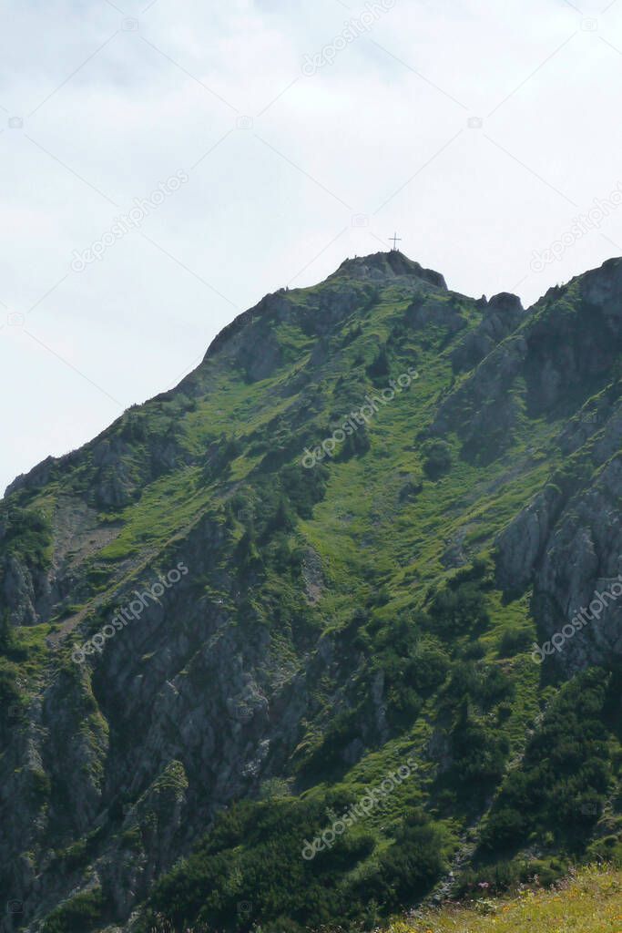 Summit cross at Tegelberg via ferrata in Bavaria, Germany