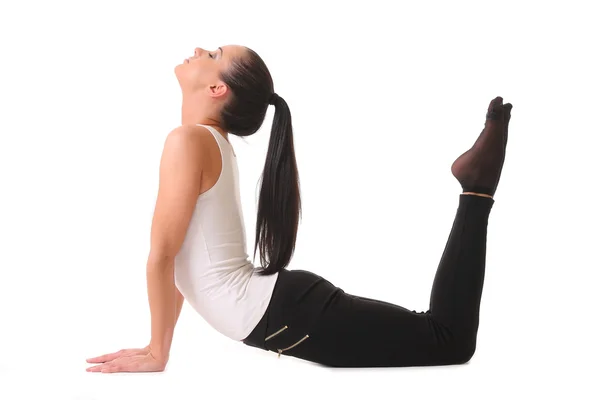 Ung kvinna gör yoga. isolerad på vit — Stockfoto