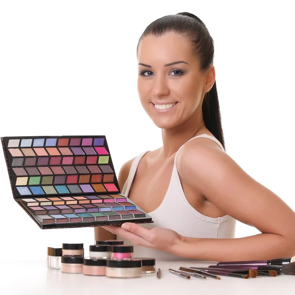 Beautiful young girl with cosmetics — Stock Photo, Image