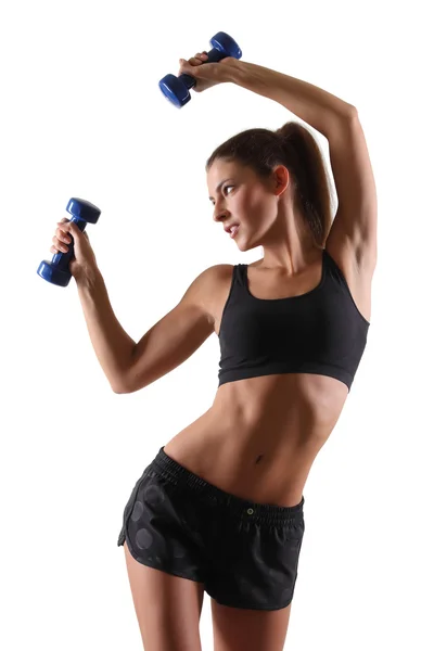 Menina desportiva com dumbbells.over fundo branco — Fotografia de Stock