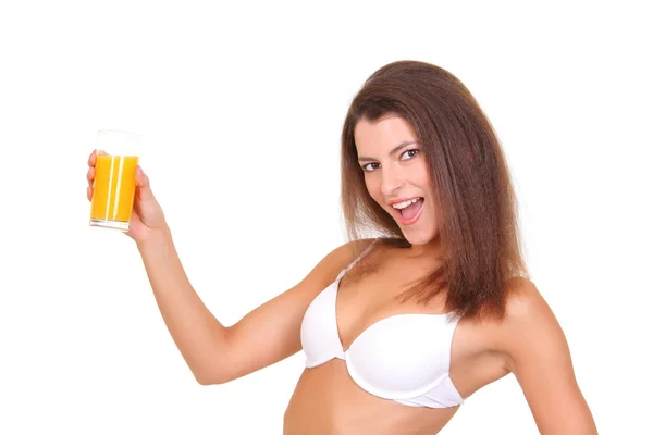 Beautiful athletic girl with a glass of orange juice — Stock Photo, Image