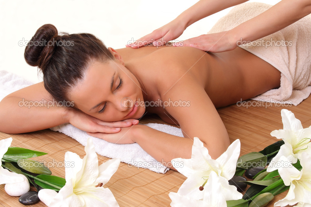 beautiful woman getting a massage in the salon
