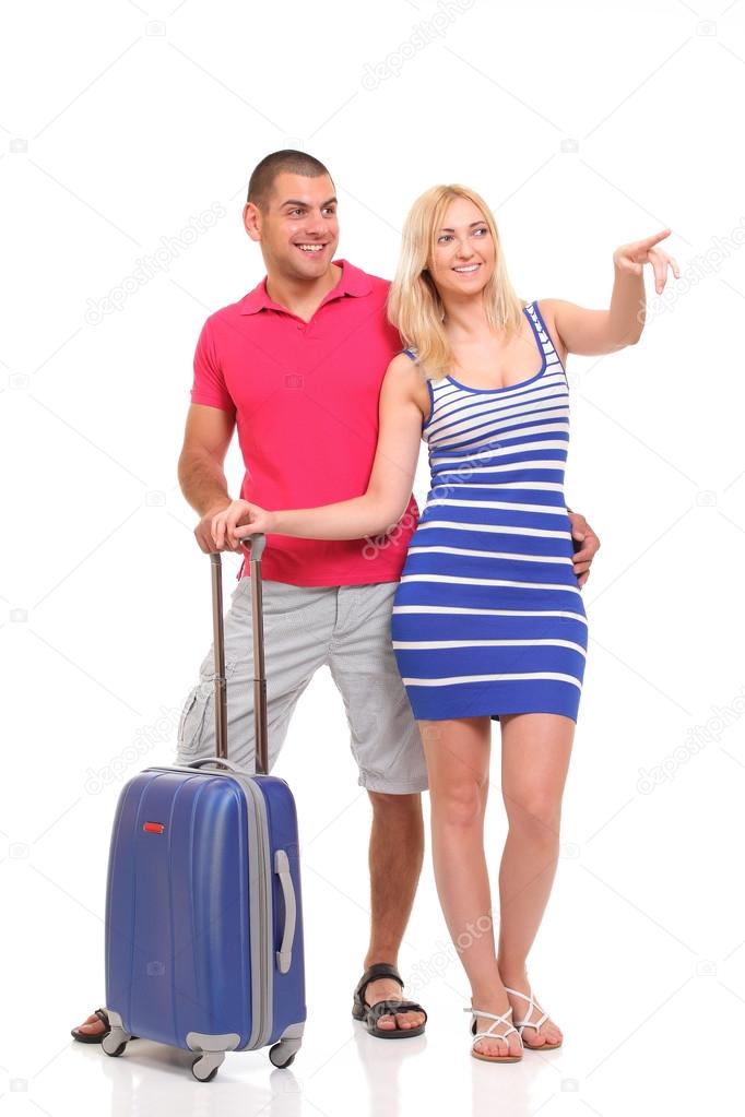 happy young woman and a man with a suitcase for travel