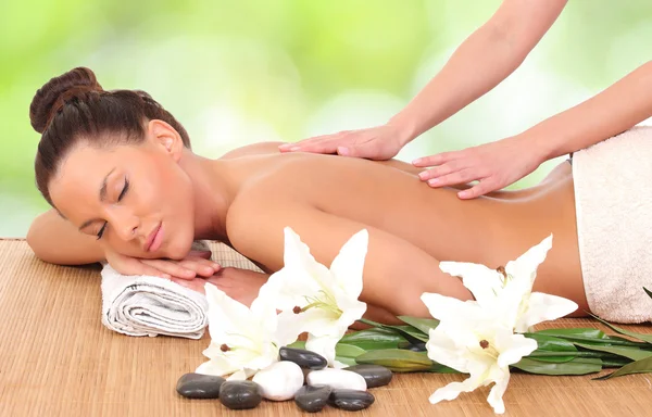 Beautiful woman enjoying a massage therapy — Stock Photo, Image