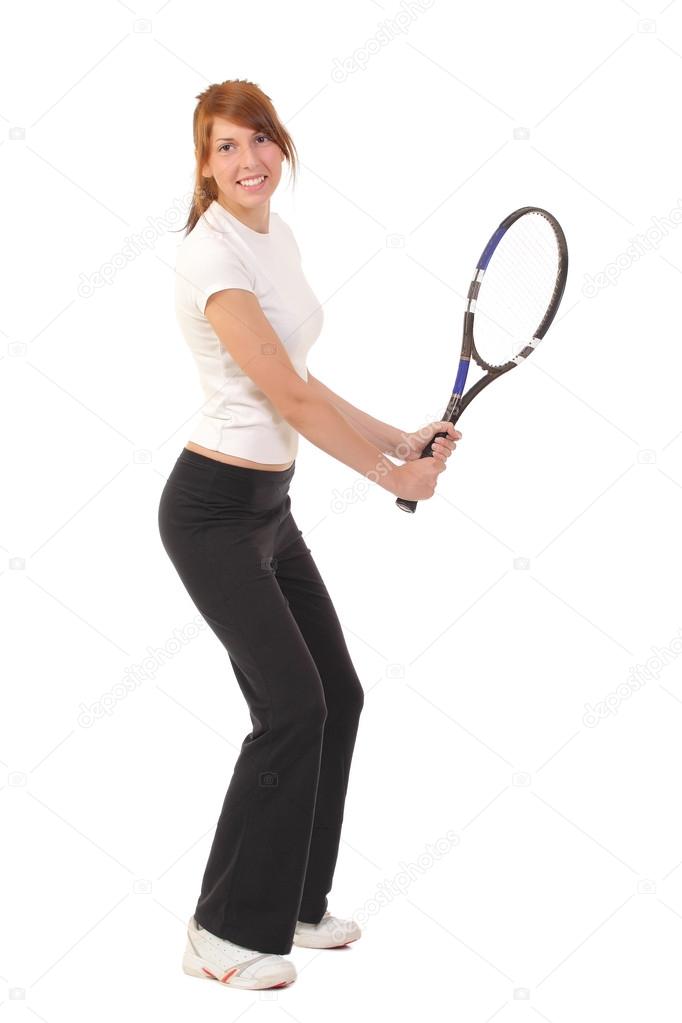Slim brunette playing tennis