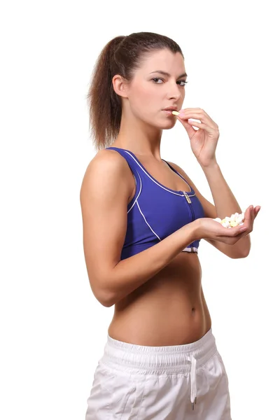 Woman with pills in hand — Stock Photo, Image