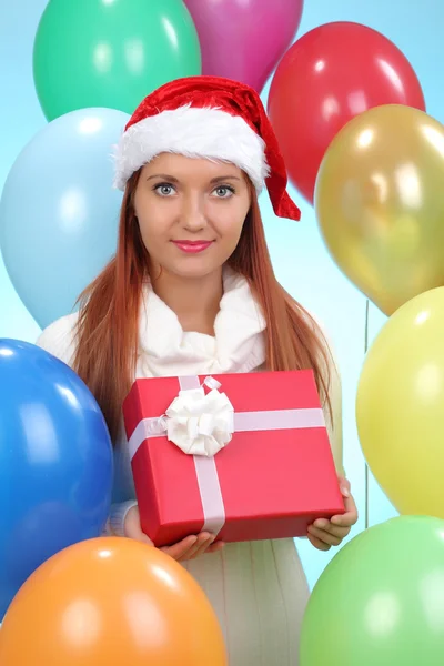 Beautiful girl holding gifts — Stock Photo, Image