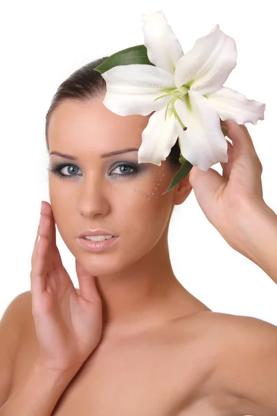 Young beautiful girl with a lily — Stock Photo, Image