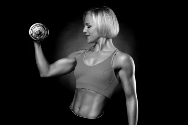 Woman lifting dumbbells — Stock Photo, Image