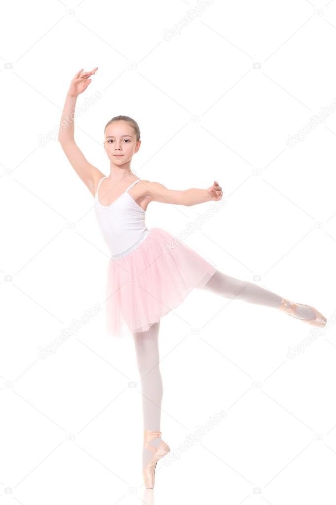 school age girl playing dress up wearing a ballet tutu