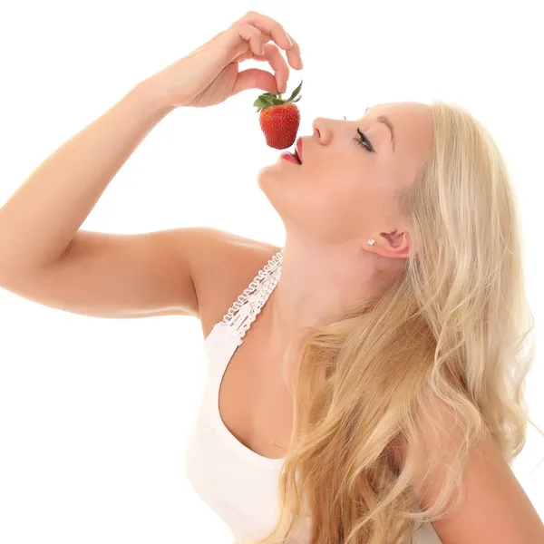 Woman eats strawberry — Stock Photo, Image