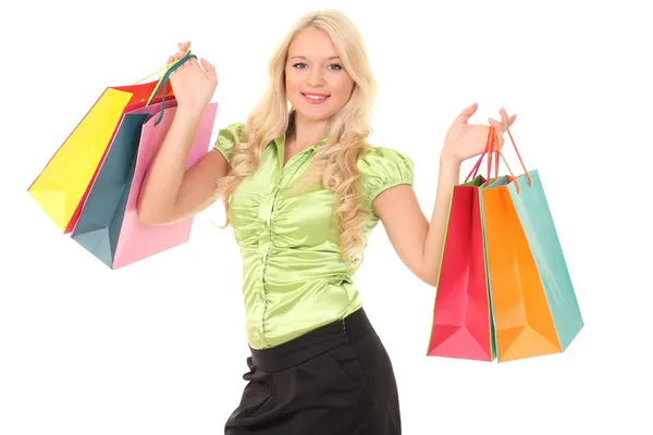Portret młodej uśmiechniętej kobiety z torbami na zakupy — Zdjęcie stockowe