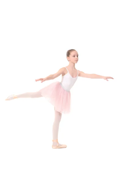 Niña en edad escolar jugando a vestir con un ballet, aislado en blanco —  Fotos de Stock