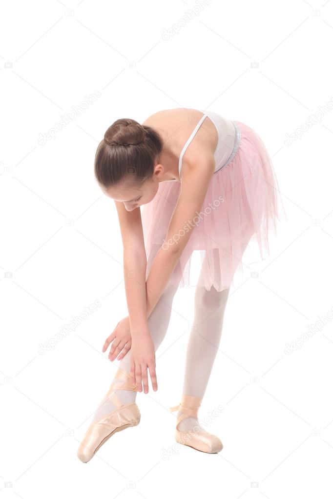 school age girl playing dress up wearing a ballet , isolated on white 