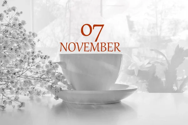 Calendar date on light background with porcelain white tea pair and white gypsophila with copy space. November 7 is the seventh day of the month — Stock Photo, Image