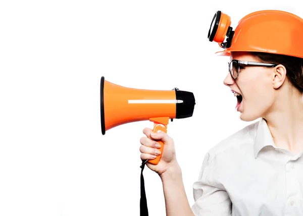 Megaphone screaming engineer contractor business woman with hard hat yelling angry, mad and upset in profile. Funny image of multicultural young professional isolated on white background in studio — Stock Photo, Image