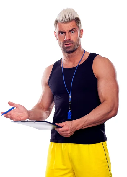 Personal Trainer, com uma almofada na mão, isolado em branco — Fotografia de Stock