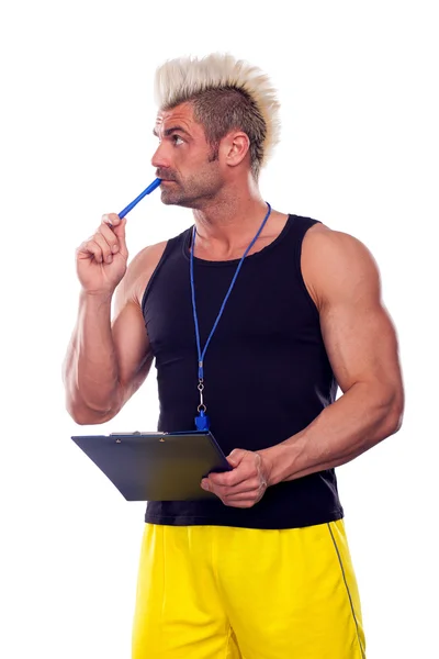 Personal Trainer, com uma almofada na mão, isolado em branco — Fotografia de Stock