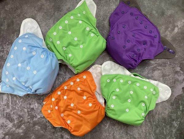 A set of reusable diapers. A lot of cloth diapers for children for reusable use.