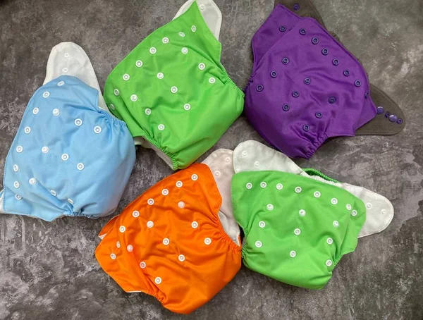 A set of reusable diapers. A lot of cloth diapers for children for reusable use.