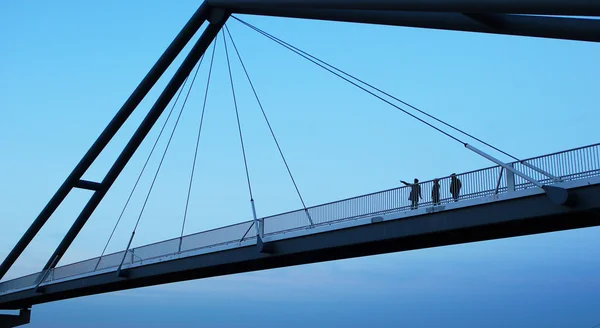 Persons walking on a bridge — Stock Photo, Image