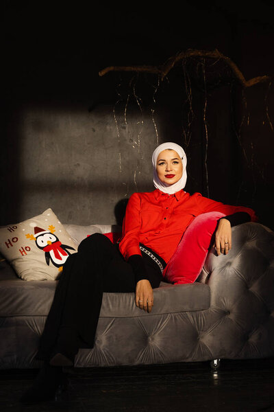 Muslim woman near christmas lights and decoration in studio. Professional muslim model posing at the new year eve. — Stock Image Muslim Woman Christmas Lights Decoration Studio Professional Muslim Model Posing Royalty Free Stock Photos