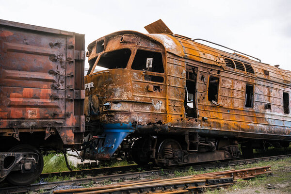 Exploded trains and wagons at the railway station in the city of Trostyanets. Sumy region. Civil buildings. Russian military invasion of Ukraine