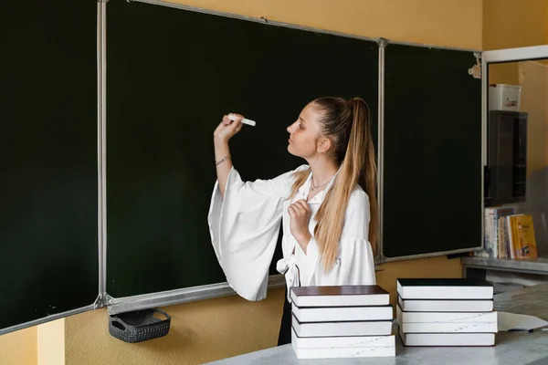 Schoolgirl Writes Chalk Blackboard Education School Excellent Pupil Many Books — Zdjęcie stockowe