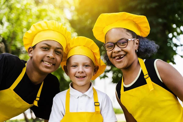 Multiracial Company Children Cooks Yellow Uniforms Smile Outdoor African Teenager — стокове фото