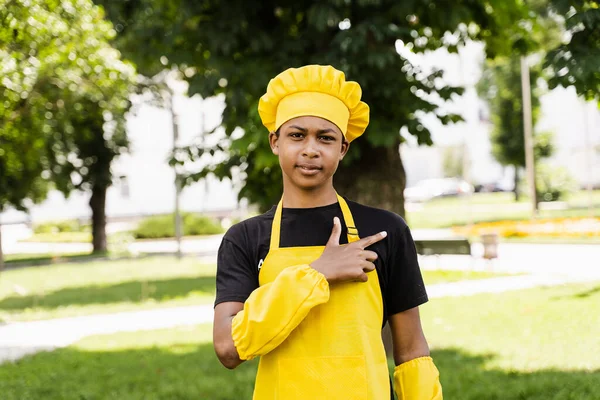 Handsome African Teenager Cook Points Right Side Black Child Cook — Stock Photo, Image