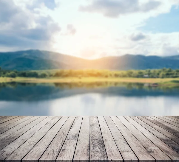 empty wooden table with river background