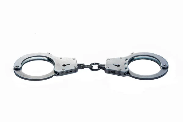 Metal handcuffs on a white isolated background — Stock Photo, Image