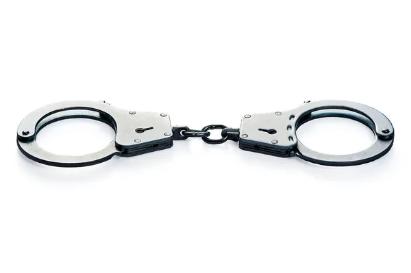 Metal handcuffs on a white isolated background — Stock Photo, Image