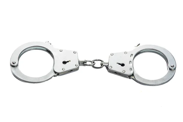 Металеві наручники на білому ізольованому фоні — стокове фото