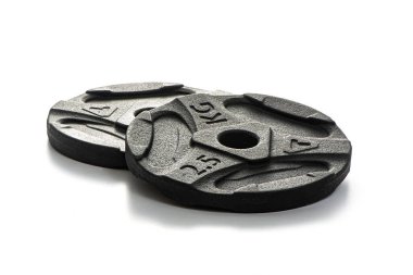 Two black metal pancakes of 2.5 kg each lie on a white isolated background