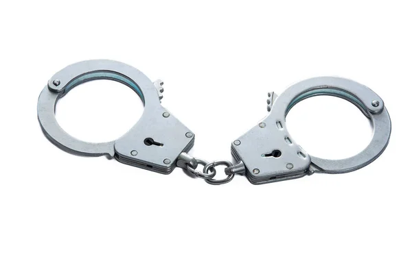 Metal handcuffs on a white isolated background — Stock Photo, Image