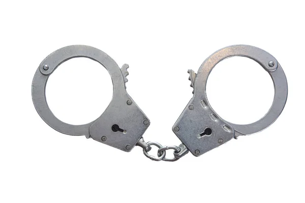Металлические наручники на белом изолированном фоне — стоковое фото