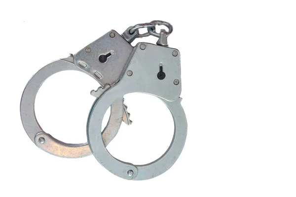 Metal handcuffs on a white isolated background — Stock Photo, Image