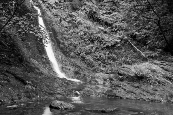 Long exposure of the White Lady waterfall on the river Lyd at Lyford Gorge in Devon