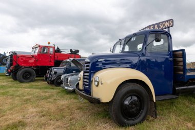 West Bay.Dorset.United Kingdom.June 12th 2022.A row of restored vintage vans and trucks are on display at the west Bay vintage rally
