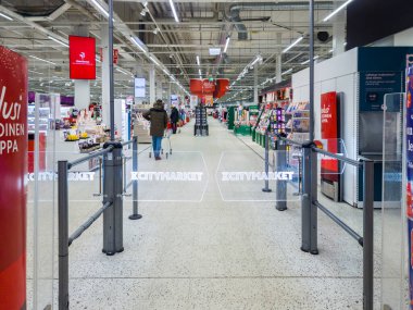 Turku, Finland - December 21, 2021: Closeup Horizontal View of K CityMarket Entrance Electric Gates.