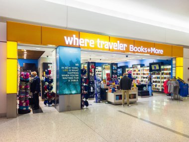 New York, USA - December 25, 2021: Horizontal View of Where Traveler Books + More Bookstore inside Terminal 5 of John Kennedy Airport with Customers inside.