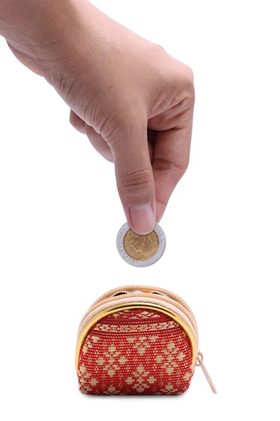 手放硬币投进泰国模式硬币袋的姿态 — 图库照片
