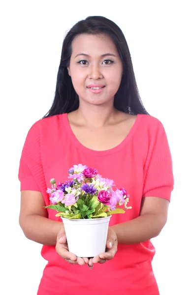 Young woman holding artificial flower, isolated on white backgr — Stock Photo, Image